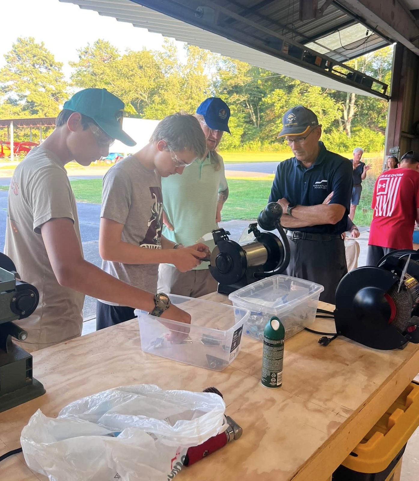 Students receive hands-on aviation instruction in a chapter workshop.